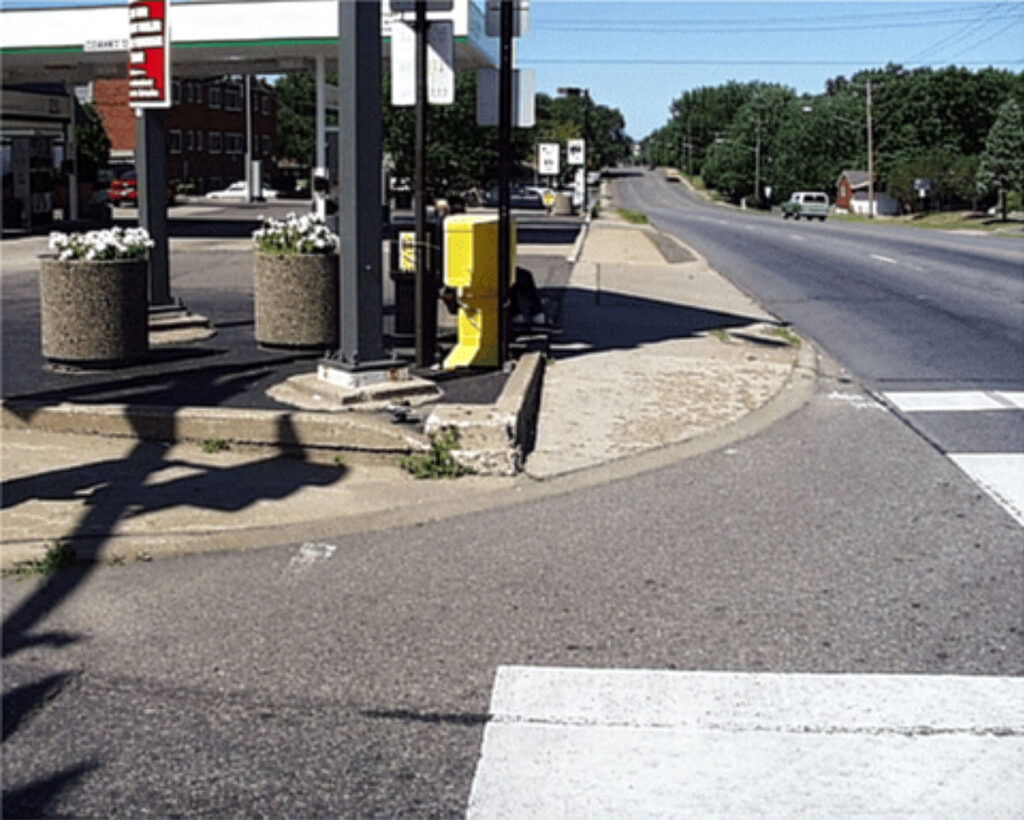 View of the southwest corner of Portland and 66th before 2007, taken from the south leg crosswalk