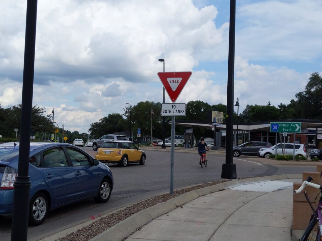 A cyclist "takes the lane" in the Portland and 66th roundabout